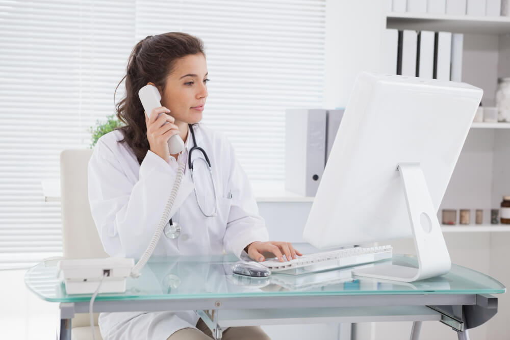 Female medical doctor talking on the phone